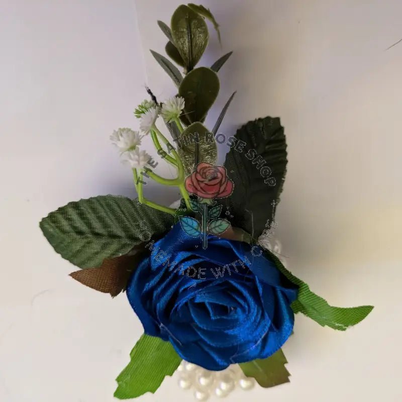 Handmade Royal Blue Satin Rose Corsages with green leaves and white baby's breath flowers